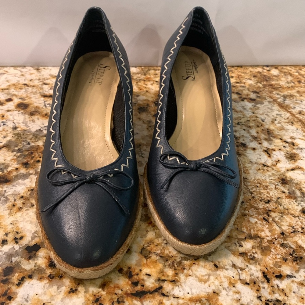 Step Up Comfort Blue Espadrilles with white stitching and bow detail.